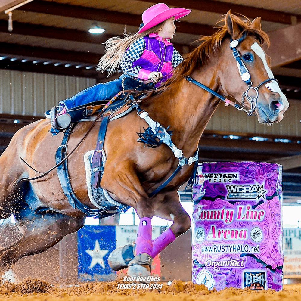 Dallie Scott "Punchy" is a 6-year-old Organnact athlete riding her horse on barrel racing